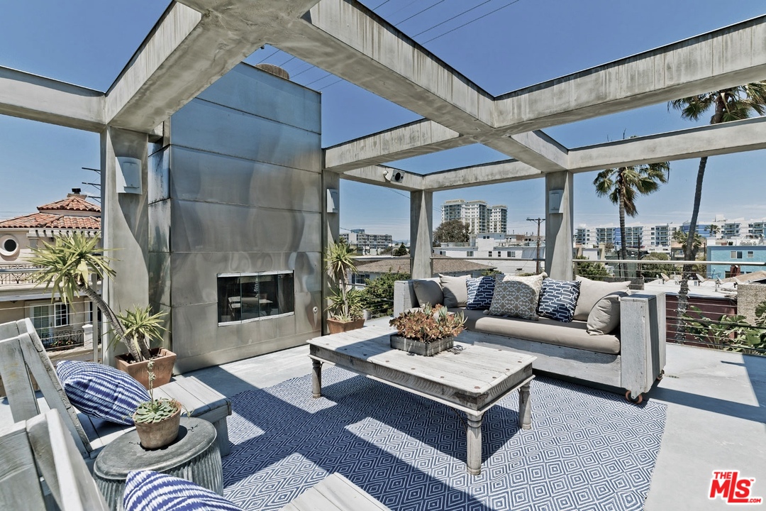 32 Fleet Street Marina del Rey, CA 90292 - Photo 23 of 39 a living room with furniture and a fireplace