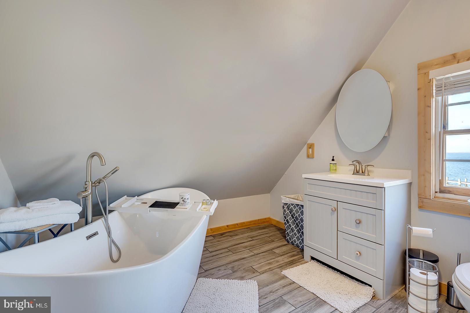 7950 Riverview Road Westover, MD 21871 - Photo 23 of 57 a bathroom with a sink and a mirror