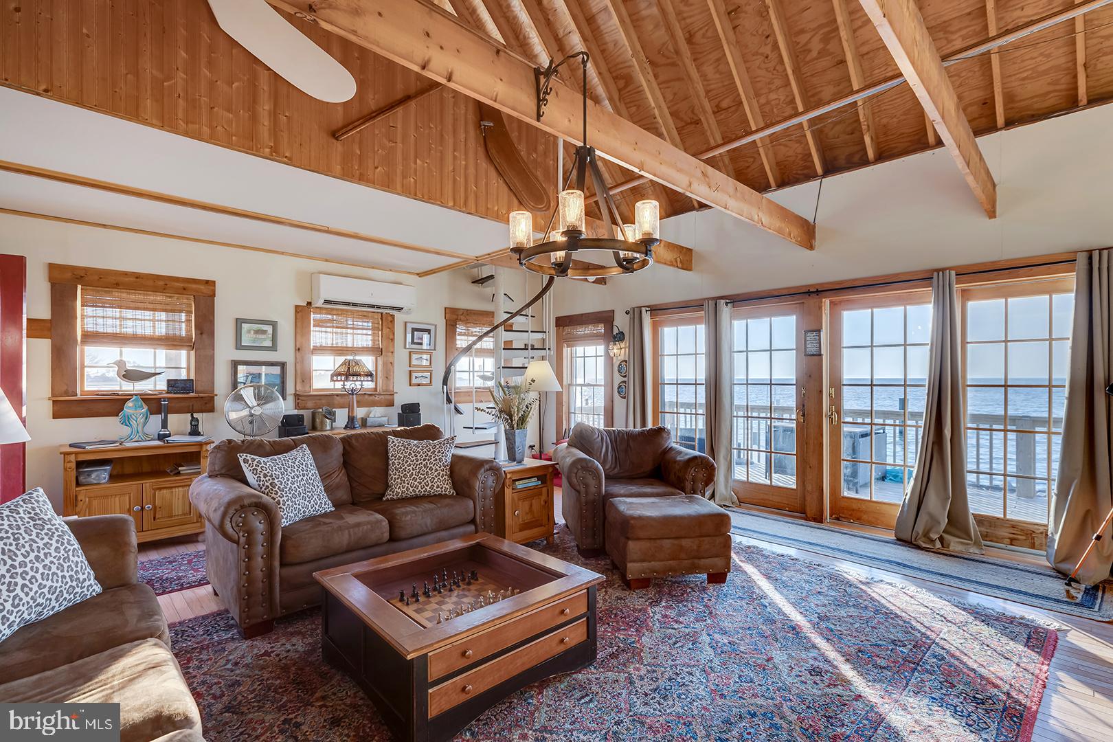 7950 Riverview Road Westover, MD 21871 - Photo 6 of 57 a living room with furniture and a floor to ceiling window