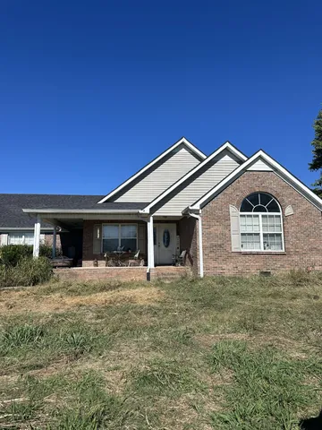 a front view of a house with yard