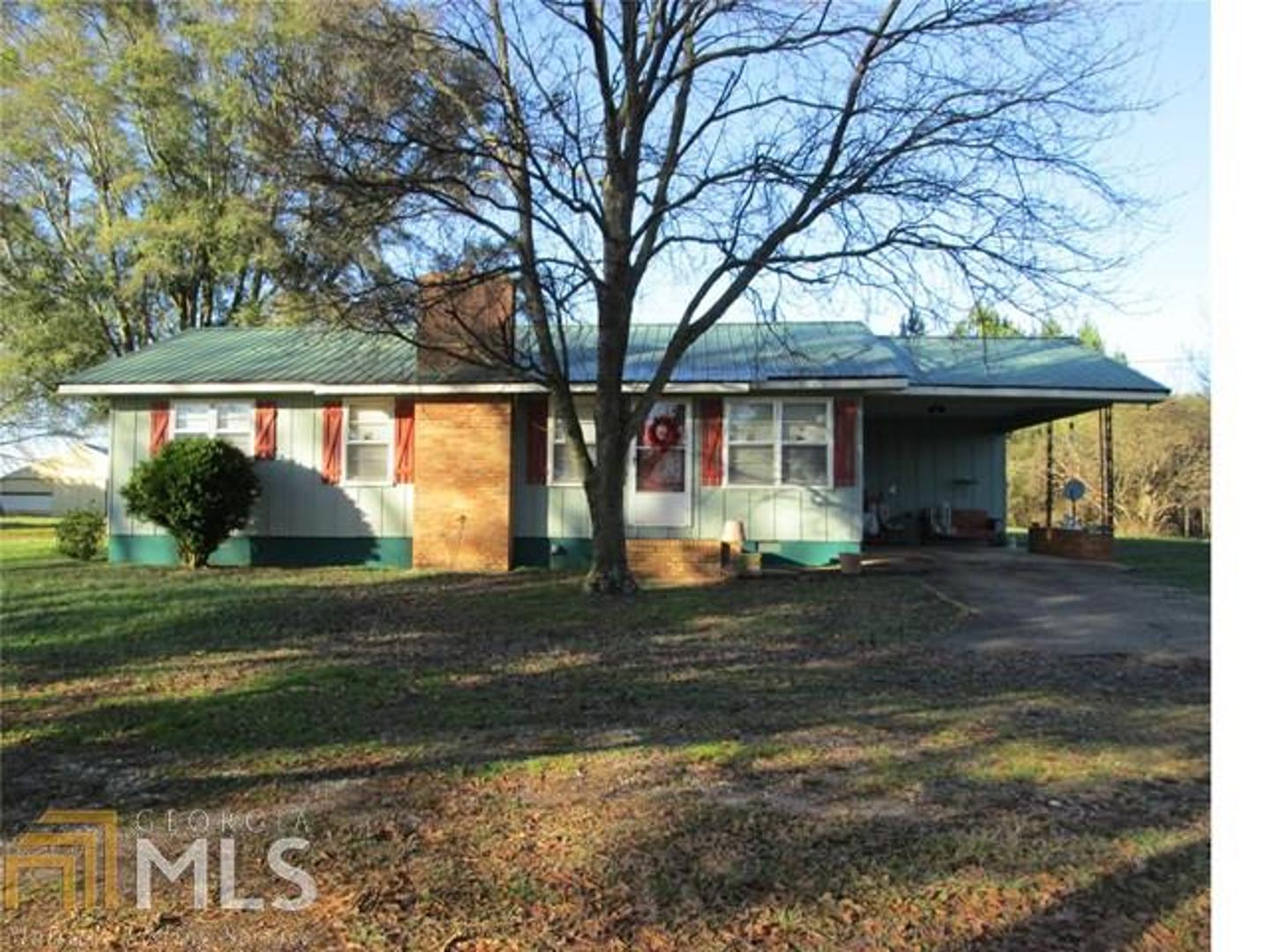 22739 Main Street Ranburne, AL 36273 - Photo 1 of 1 a front view of a house with garden