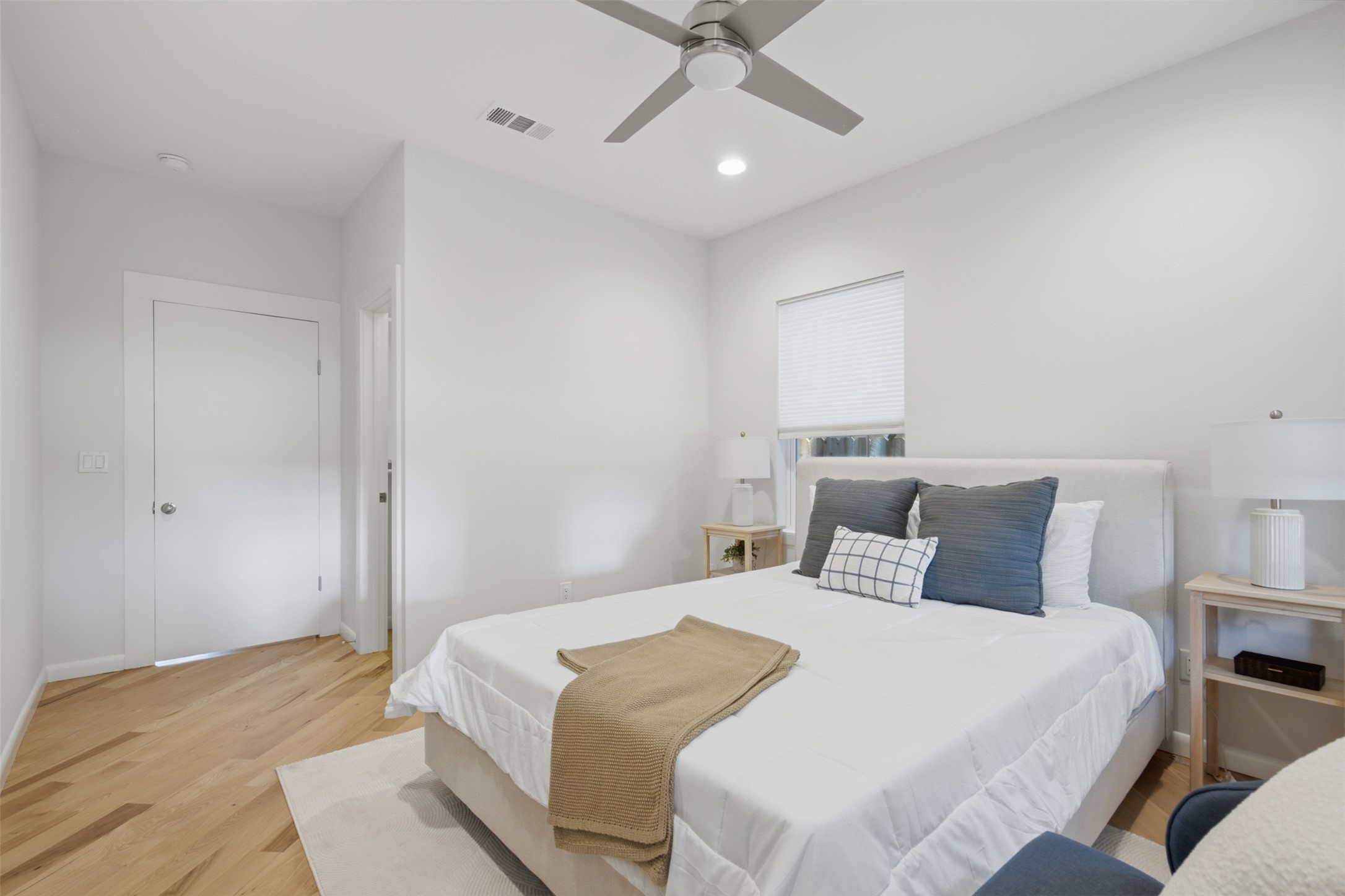 206 East 43rd Street Austin, TX 78751 - Photo 19 of 29 The continuation of the gleaming hardwoods, and the neutral colored walls, in this bedroom, sets the tone for the nightly sanctuary.