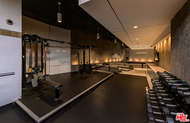 a room with pool table and windows