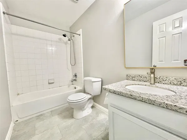 a bathroom with a sink a toilet and a bathtub