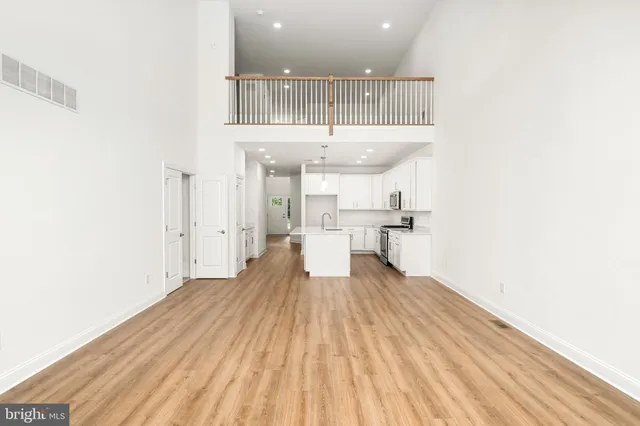 a view of a kitchen with wooden floor