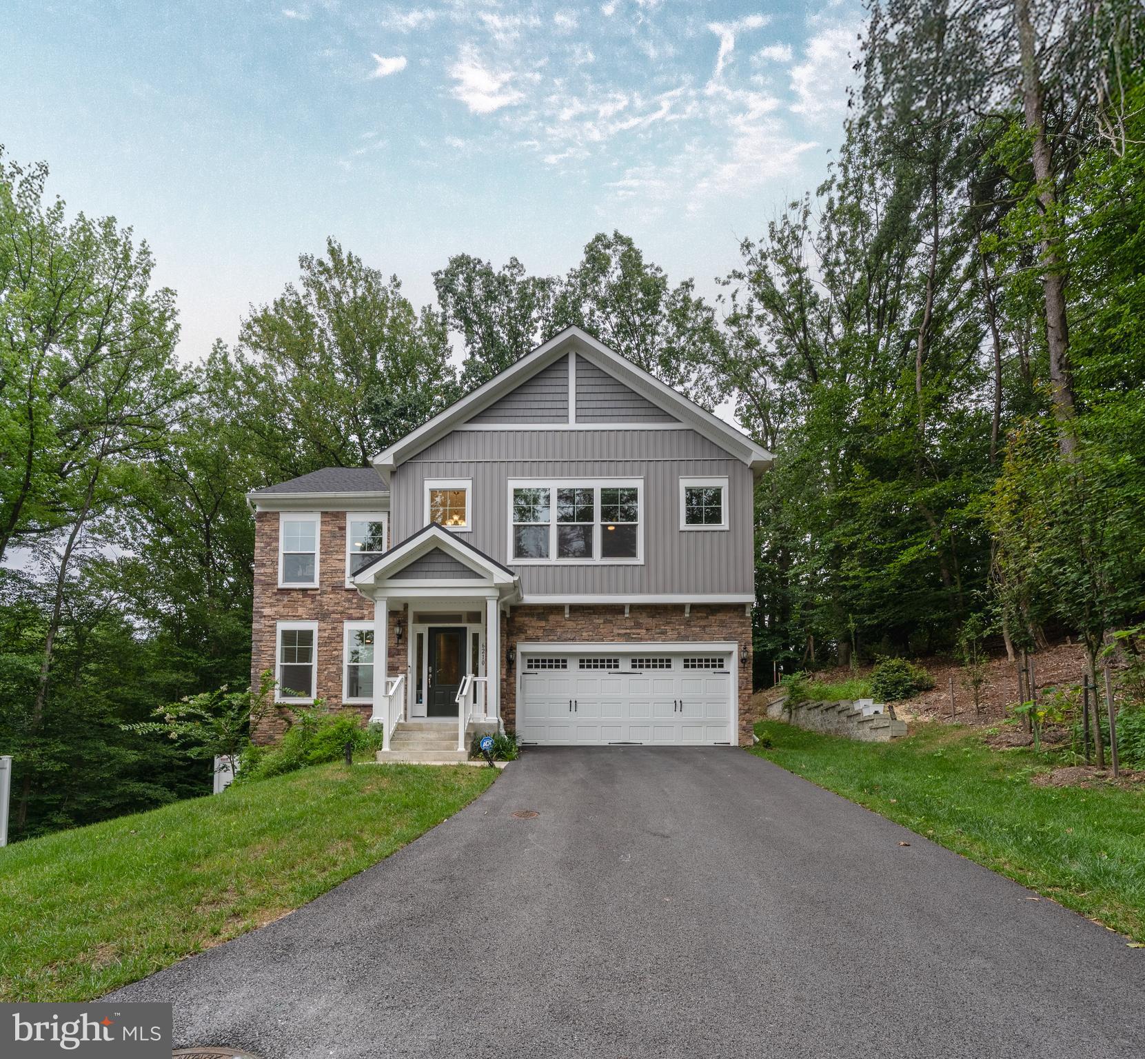 6210 Hunters Hollow Road Elkridge, MD 21075 - Photo 1 of 41 a front view of a house with a yard and garage