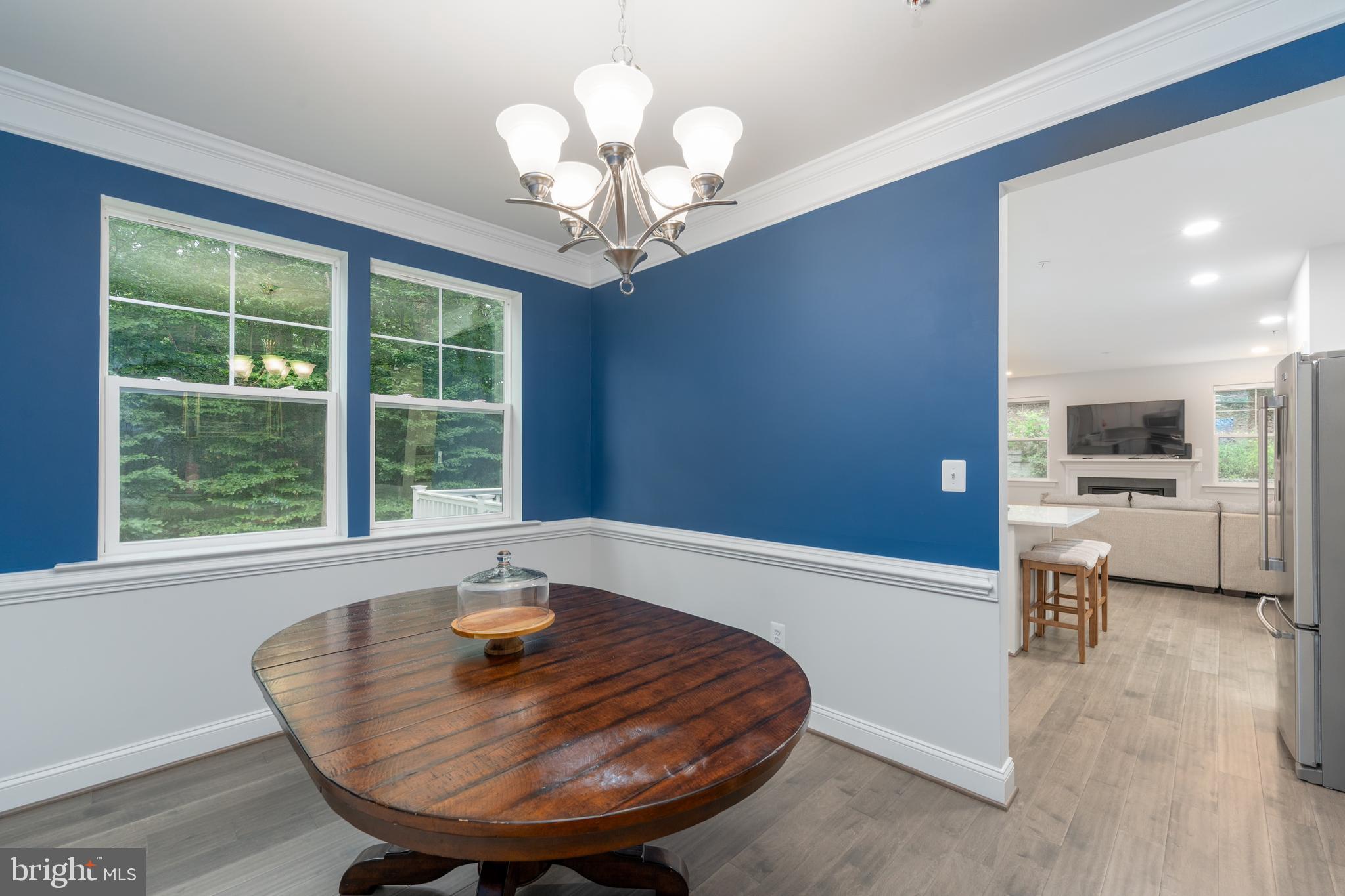 6210 Hunters Hollow Road Elkridge, MD 21075 - Photo 11 of 41 a view of a dining room with furniture window and outside view