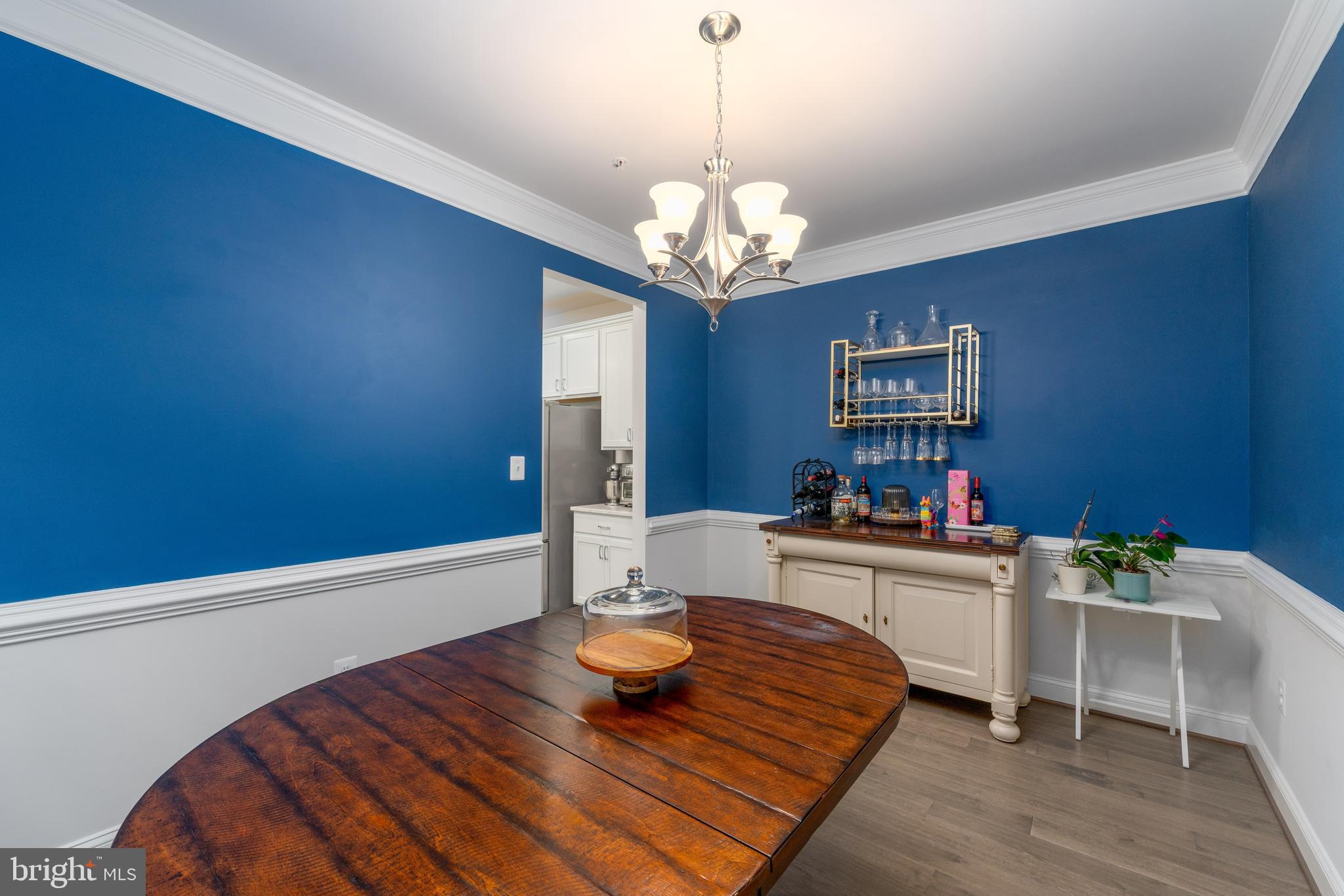 6210 Hunters Hollow Road Elkridge, MD 21075 - Photo 12 of 41 a living room with furniture and a chandelier