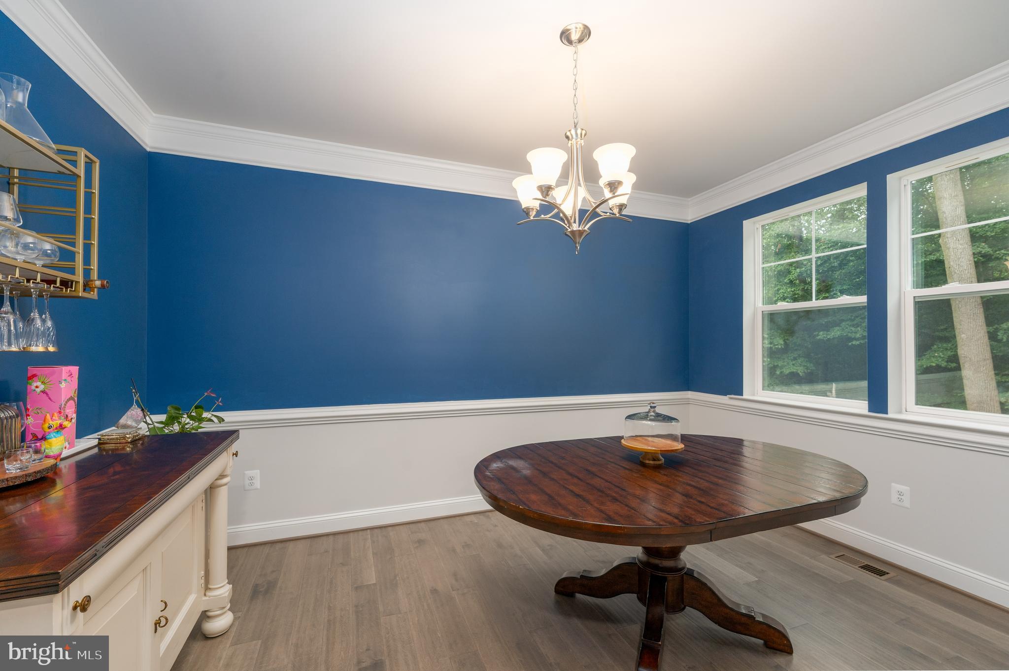 6210 Hunters Hollow Road Elkridge, MD 21075 - Photo 13 of 41 a view of a dining room with furniture window and wooden floor