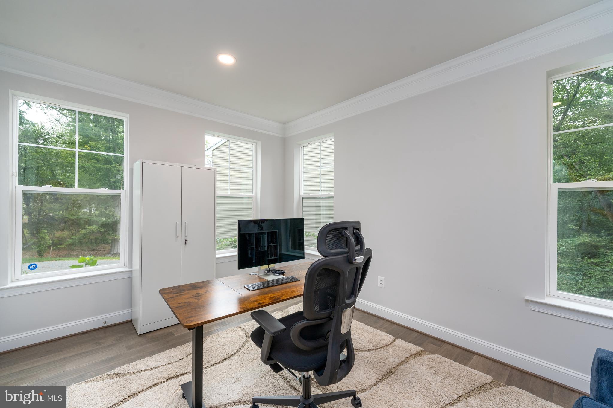 6210 Hunters Hollow Road Elkridge, MD 21075 - Photo 15 of 41 a view of a workspace with furniture and a window