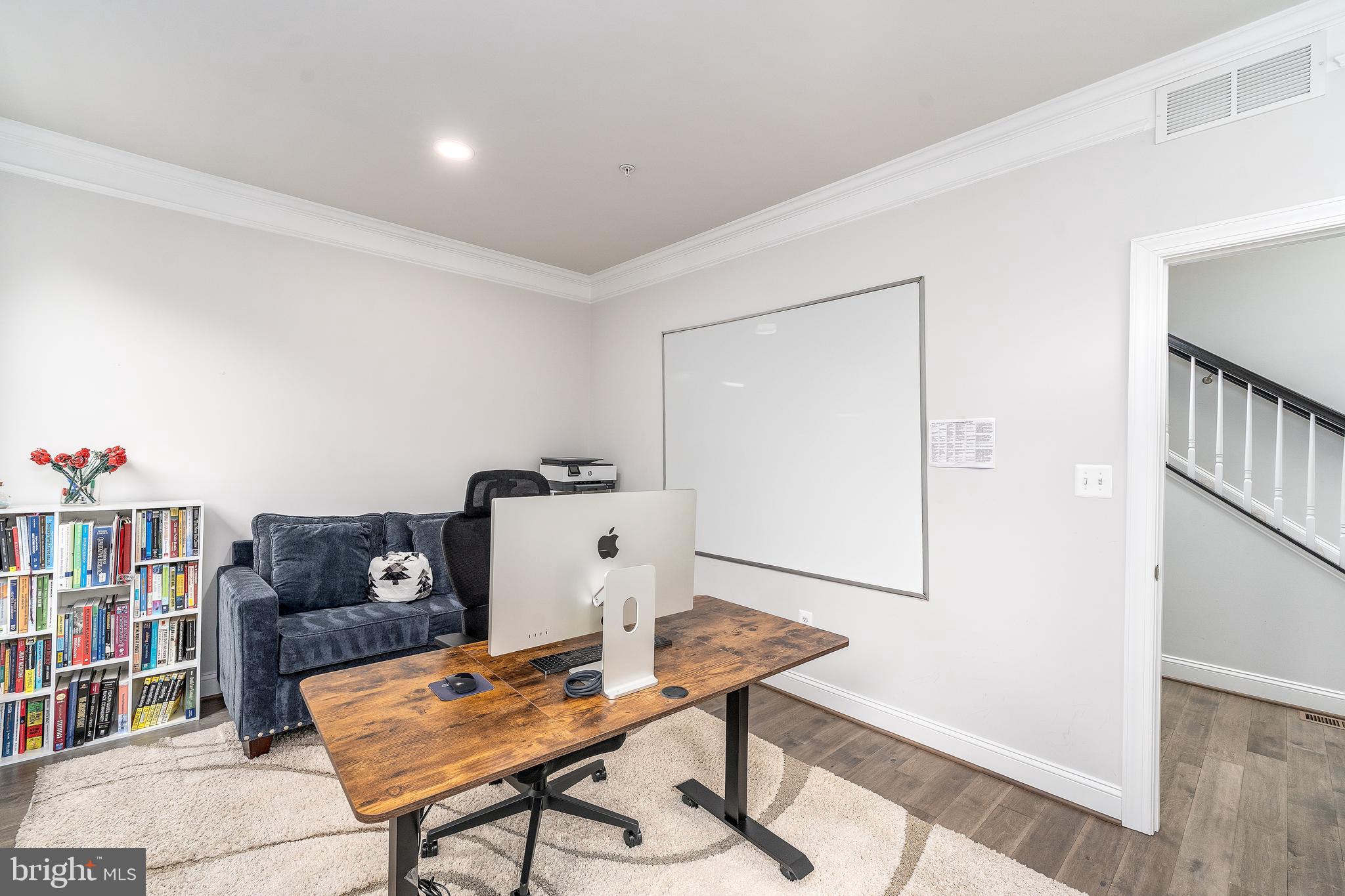 6210 Hunters Hollow Road Elkridge, MD 21075 - Photo 16 of 41 a workspace with furniture and book shelf