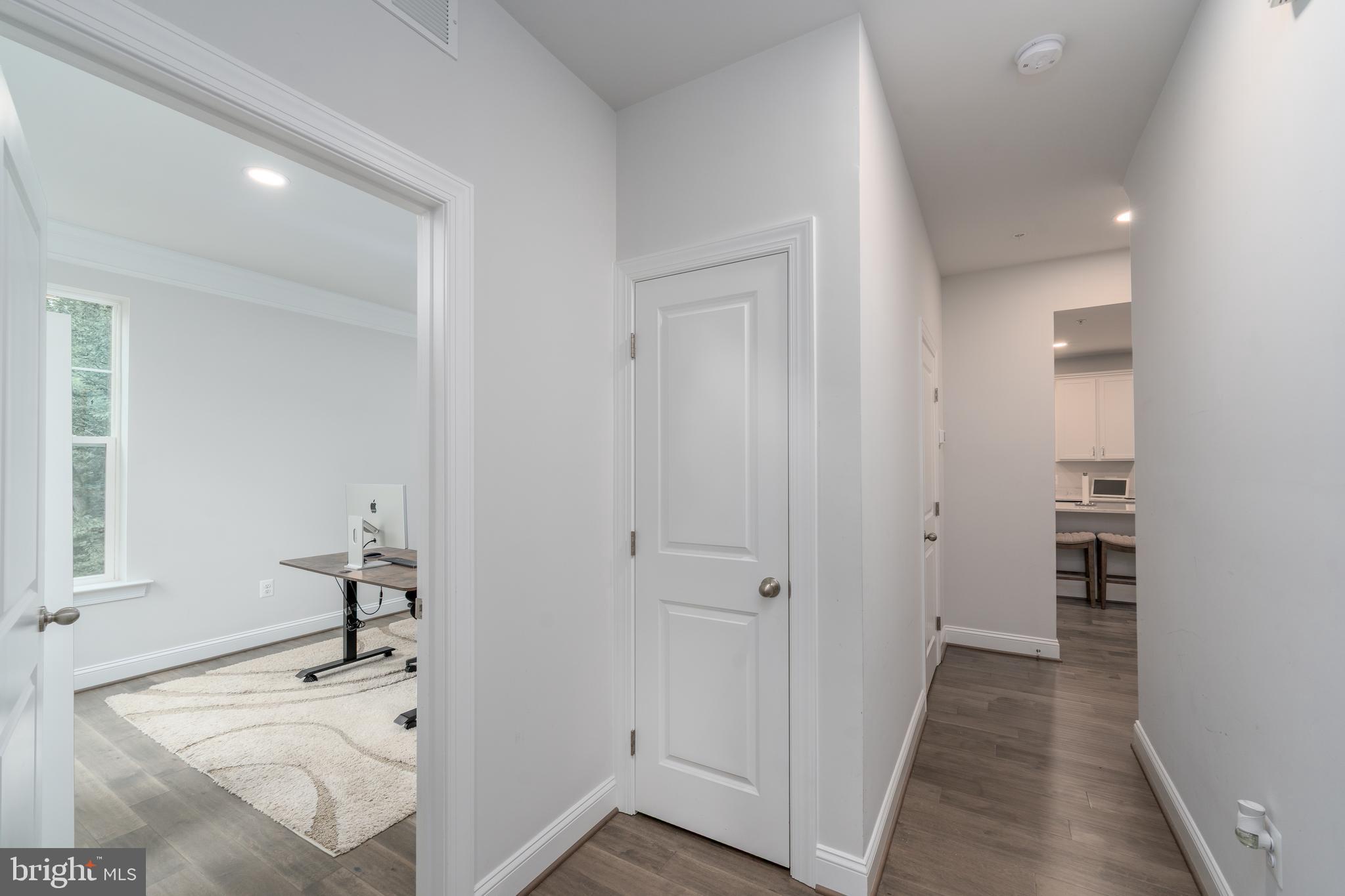 6210 Hunters Hollow Road Elkridge, MD 21075 - Photo 17 of 41 a hallway with wooden floor and closet