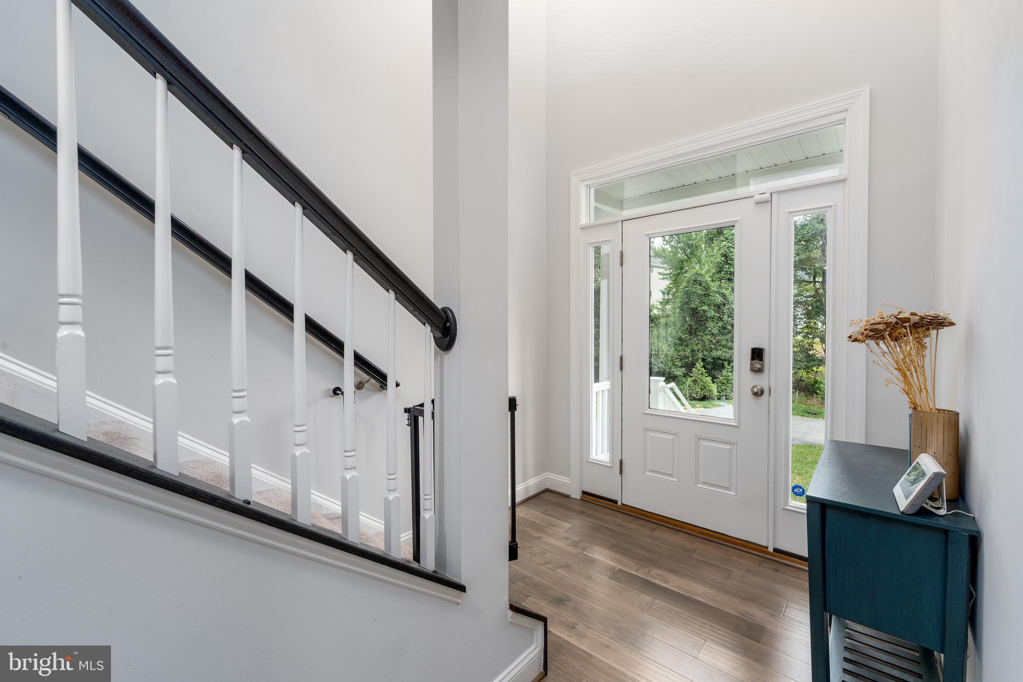 6210 Hunters Hollow Road Elkridge, MD 21075 - Photo 18 of 41 a view of hallway with stairs and wooden floor