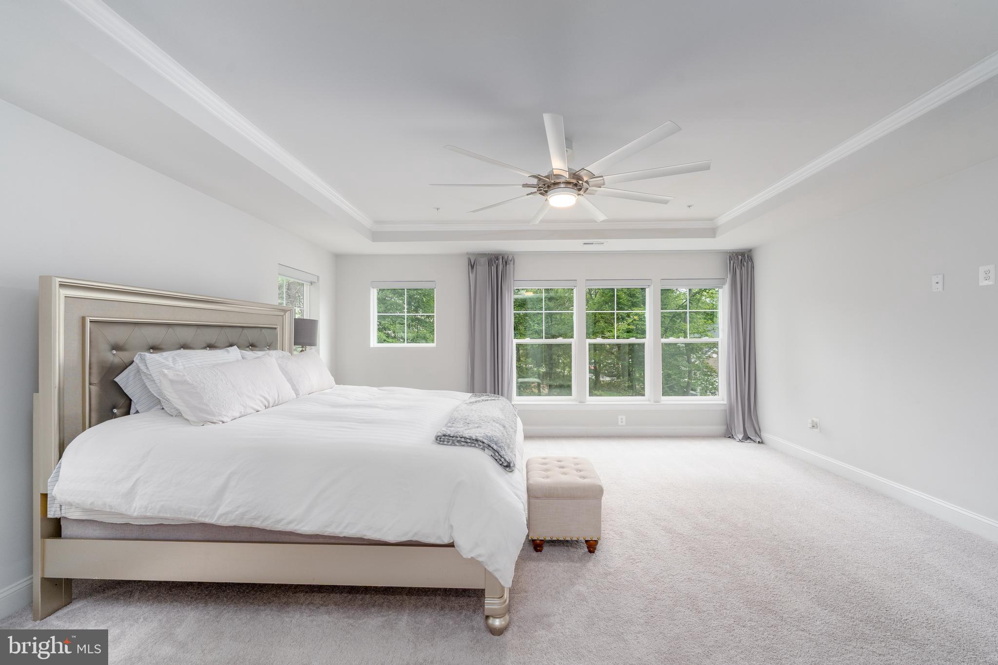 6210 Hunters Hollow Road Elkridge, MD 21075 - Photo 22 of 41 a large bed sitting in a bedroom next to a window