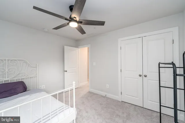 a view of a livingroom with a ceiling fan