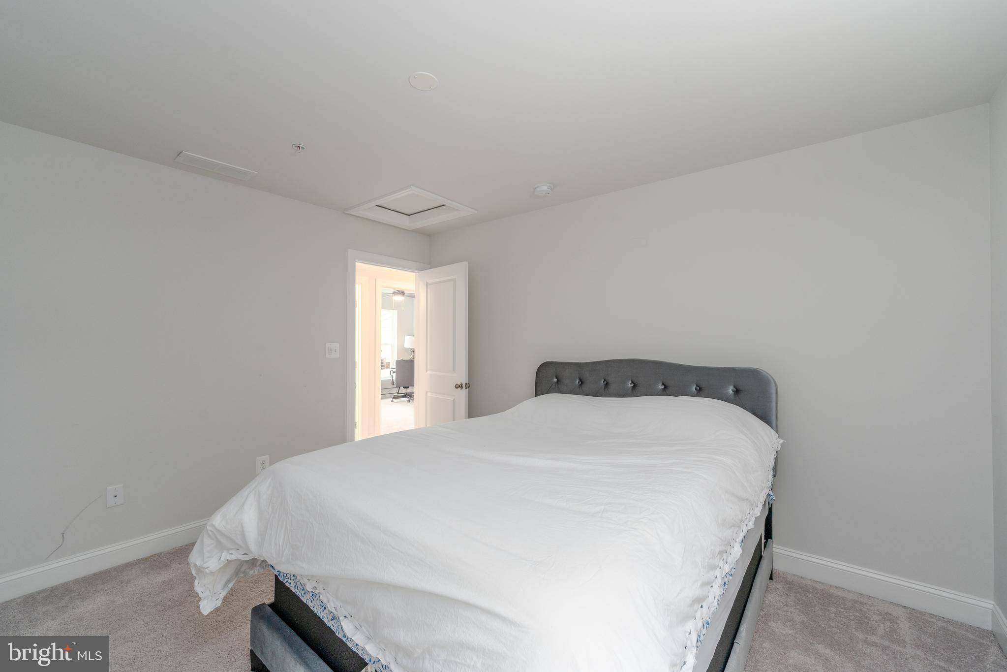 6210 Hunters Hollow Road Elkridge, MD 21075 - Photo 35 of 41 a bedroom with a bed and window