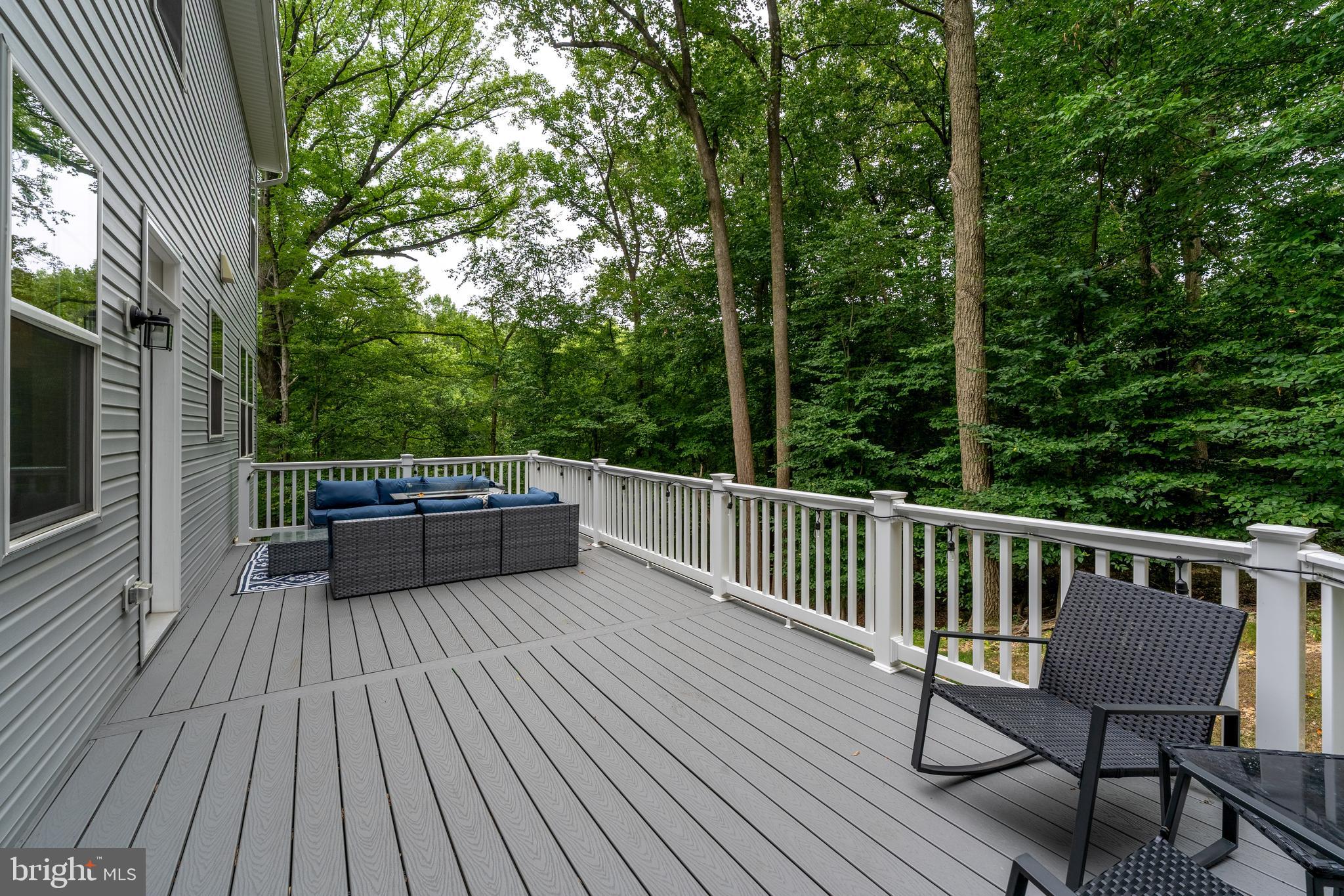 6210 Hunters Hollow Road Elkridge, MD 21075 - Photo 4 of 41 a view of balcony with wooden floor and outdoor seating