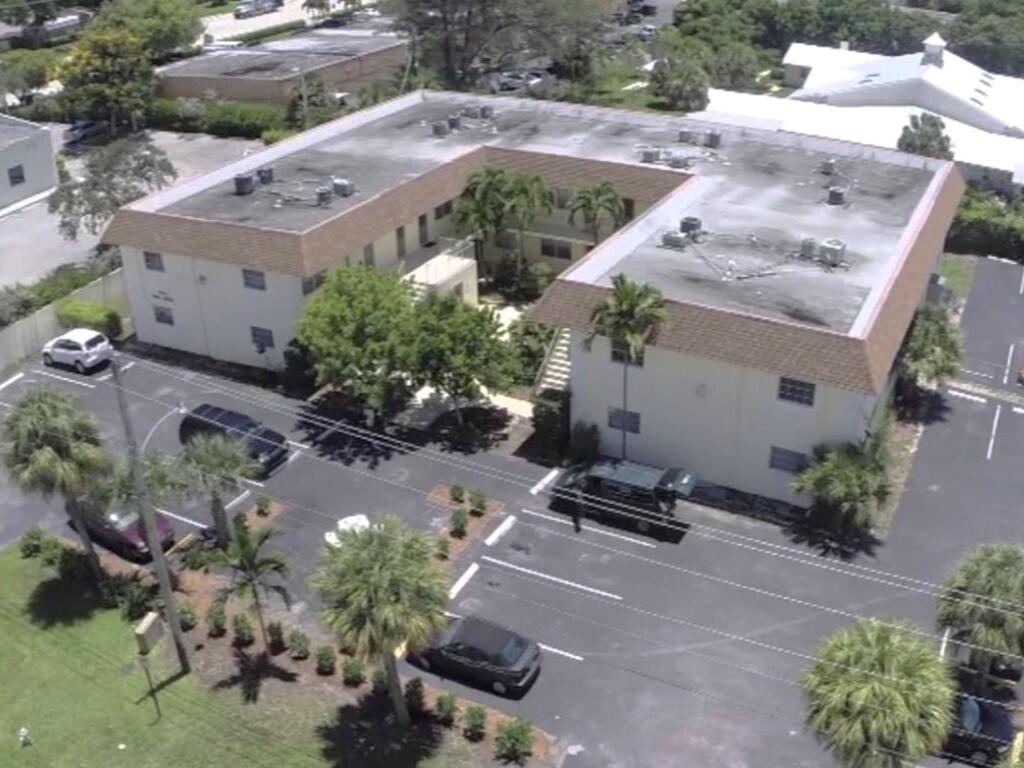 260 Northwest 19th Street, Unit 6 Boca Raton, FL 33432 - Photo 11 of 11 an aerial view of a backyard with plants and large trees