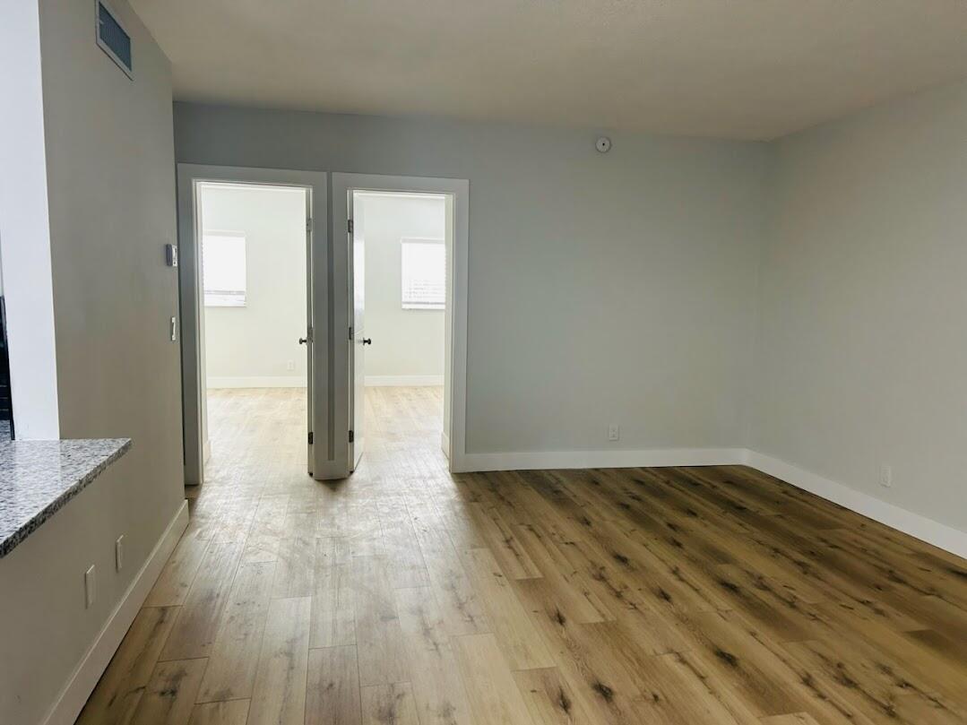 260 Northwest 19th Street, Unit 6 Boca Raton, FL 33432 - Photo 5 of 11 a view of a livingroom with wooden floor