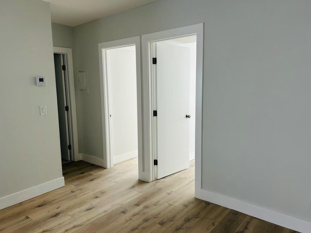 260 Northwest 19th Street, Unit 6 Boca Raton, FL 33432 - Photo 10 of 11 a view of an empty room with wooden floor