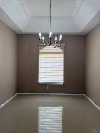 a view of a room with a windows and chandelier