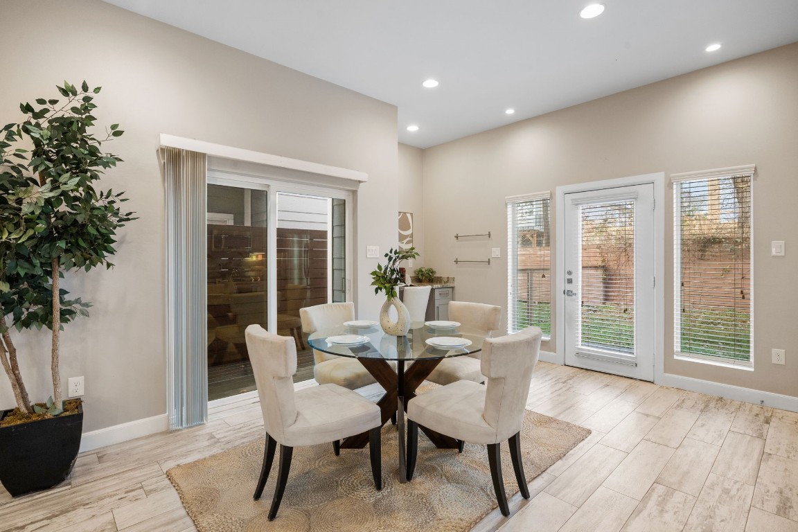 317 East 35th Street, Unit A Houston, TX 77018 - Photo 11 of 24 a dining room with furniture and wooden floor