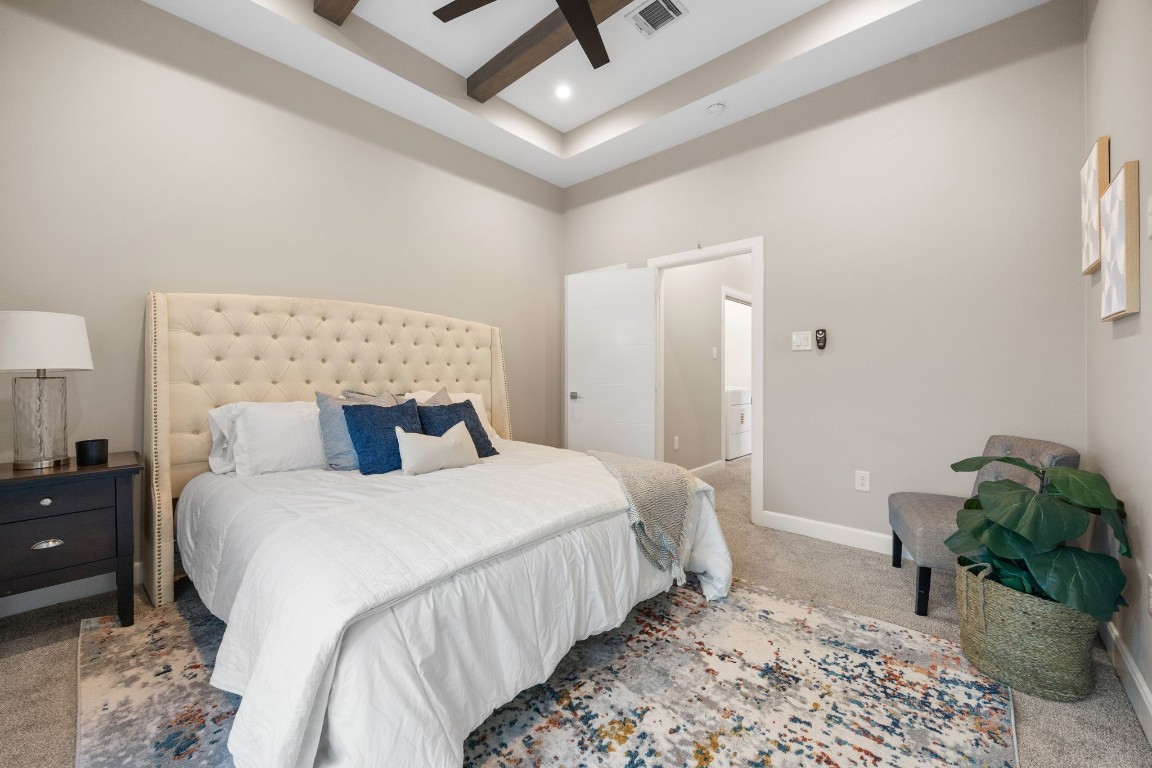 317 East 35th Street, Unit A Houston, TX 77018 - Photo 13 of 24 a bedroom with a bed and wooden floor