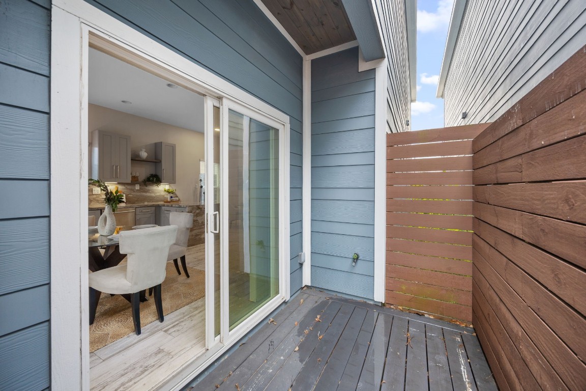 317 East 35th Street, Unit A Houston, TX 77018 - Photo 20 of 24 a view of a balcony with chairs and wooden floor