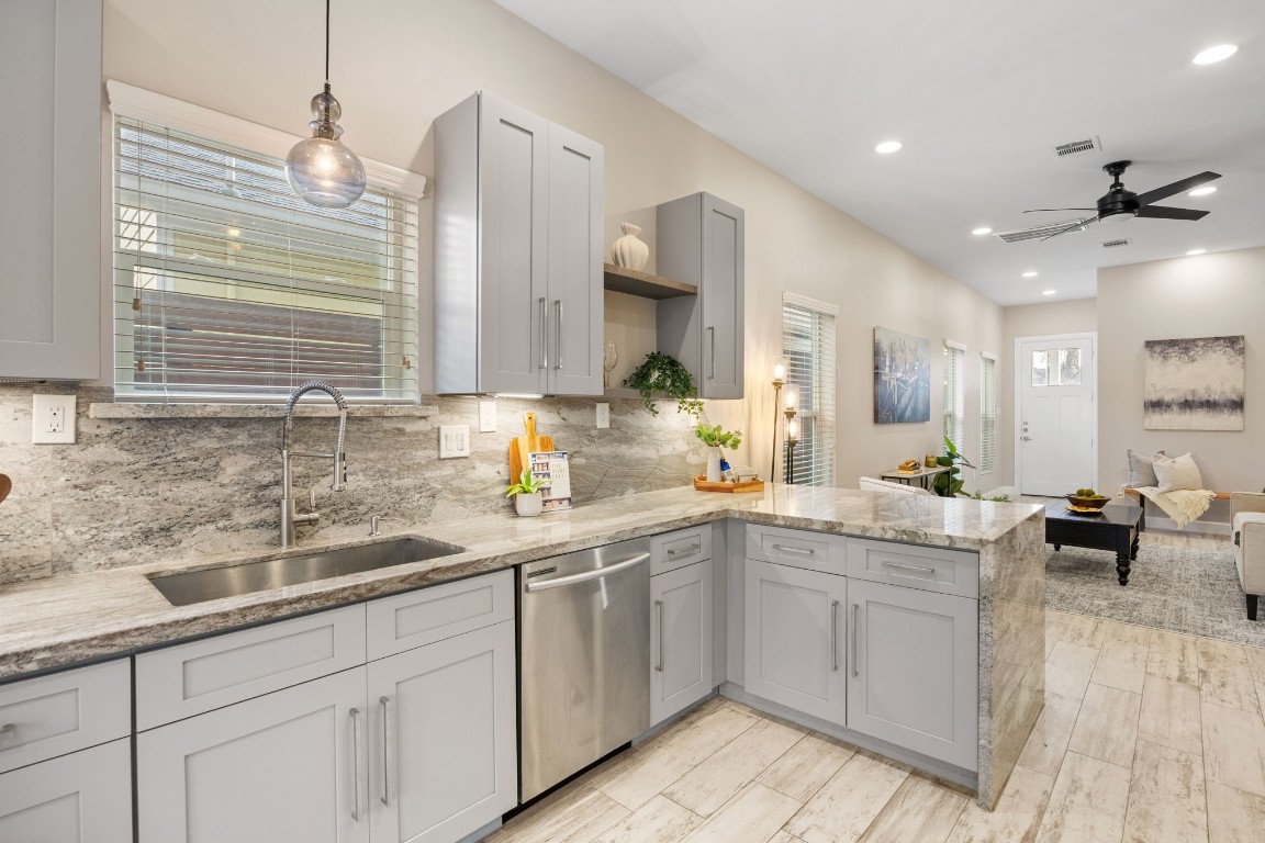 317 East 35th Street, Unit A Houston, TX 77018 - Photo 10 of 24 a kitchen with sink cabinets and window
