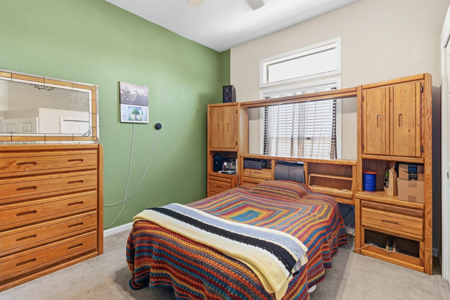 12390 Hobday Road Wilton, CA 95693 - Photo 40 of 92 a bedroom with a bed and a dresser