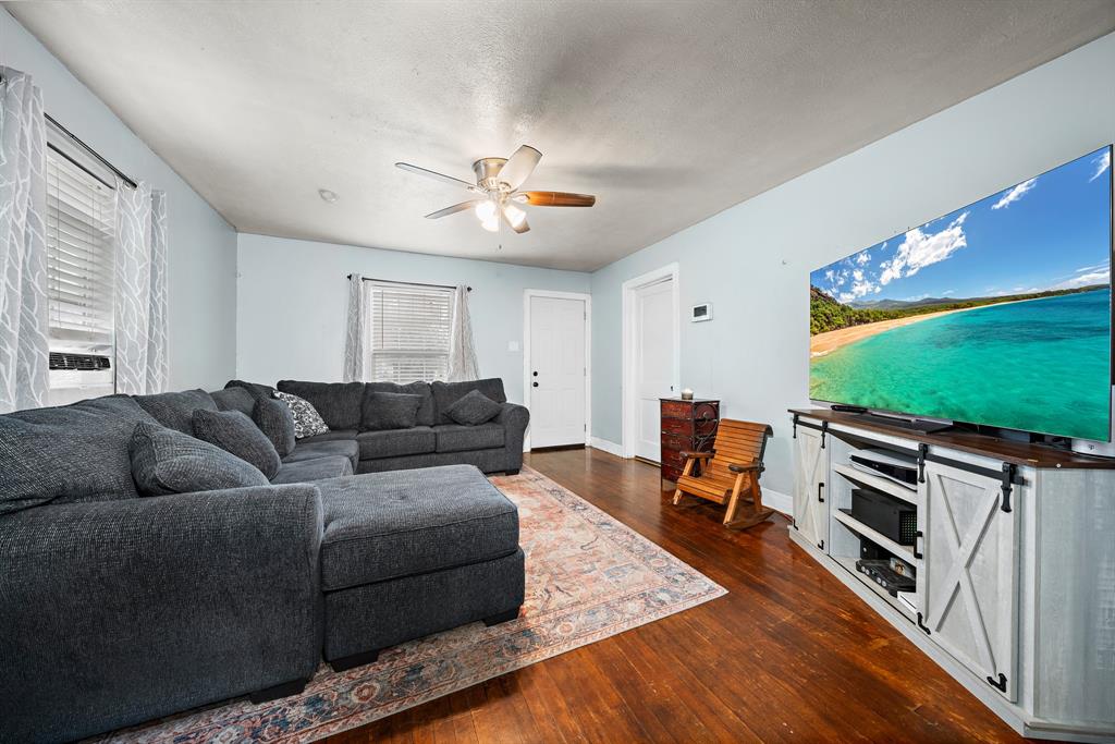 2119 Alexander Avenue Waco, TX 76708 - Photo 6 of 20 a living room with furniture and a flat screen tv