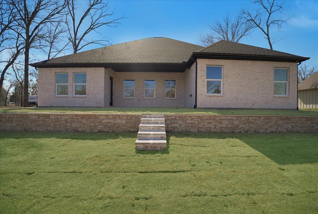448 Rs County Road Alba, TX 75410 - Photo 29 of 34 a front view of a house with a yard