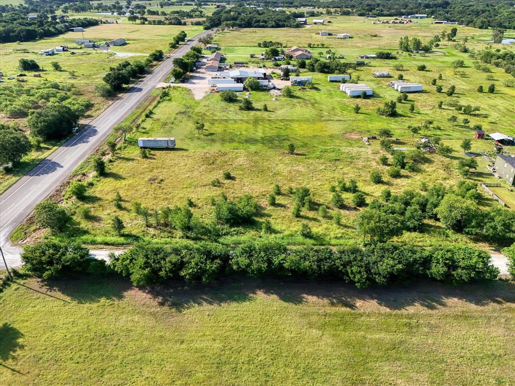 15769 Gholson Road Waco, TX 76705 - Photo 2 of 14 a view of outdoor space with garden and lake view