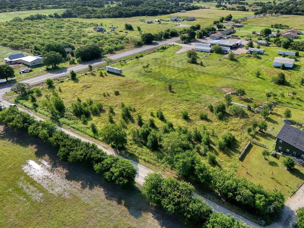 15769 Gholson Road Waco, TX 76705 - Photo 4 of 14 an aerial view of residential houses with outdoor space and trees