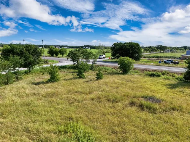 a view of a lake with houses in the back