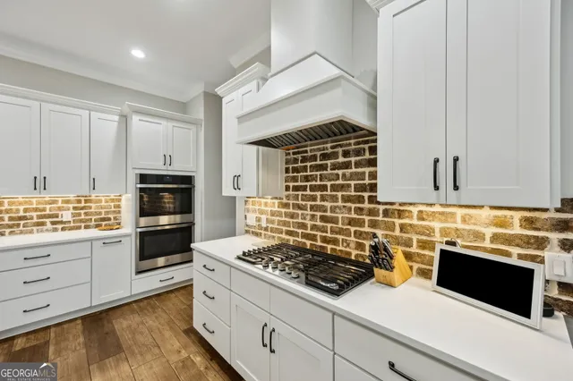 a bathroom with a shower sink vanity and mirror