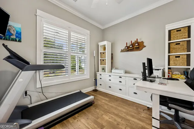 a living room with furniture a rug and a chandelier