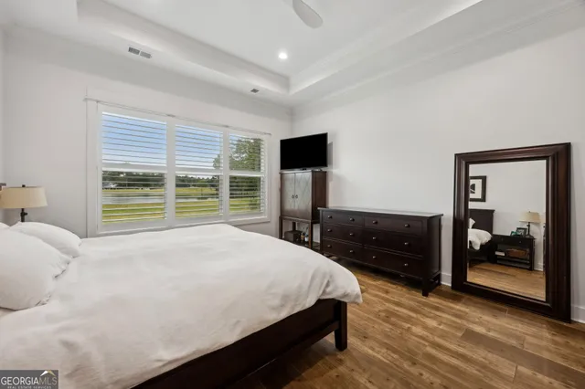 a view of a lake with houses in the background