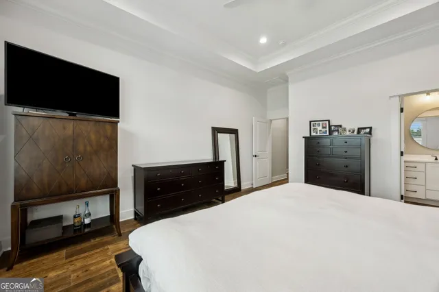 a view of a lake with a big yard and potted plants