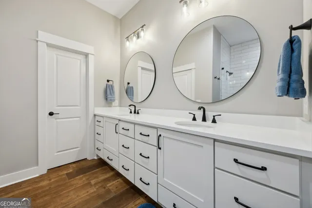 a living room with hardwood floor and a large window