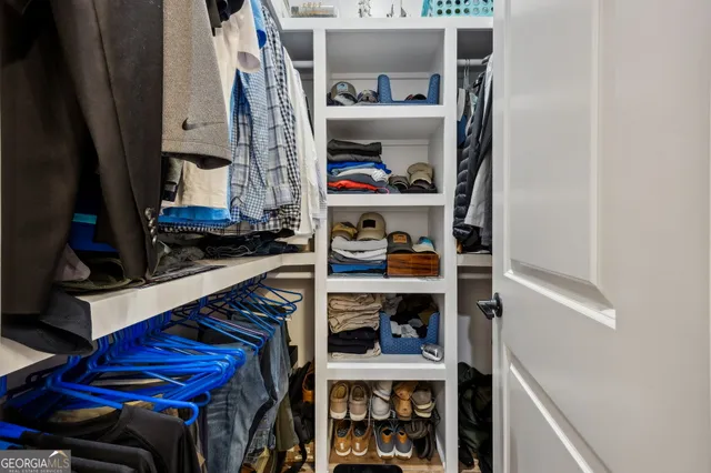 a view of a lake with houses in the back