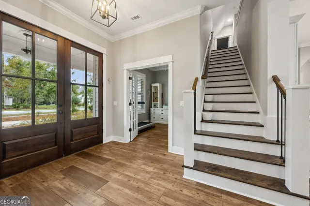 a view of a lake with houses in the back