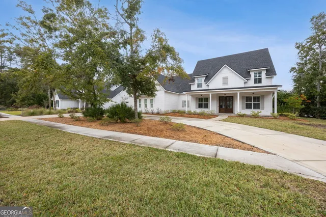 a living room with furniture kitchen view and a table