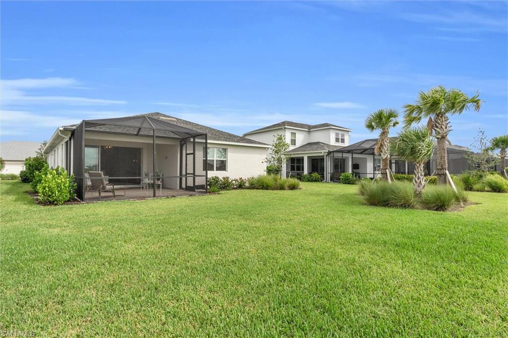 42322 Edgewater Drive Babcock Ranch, FL 33982 - Photo 28 of 40 a front view of a house with a garden