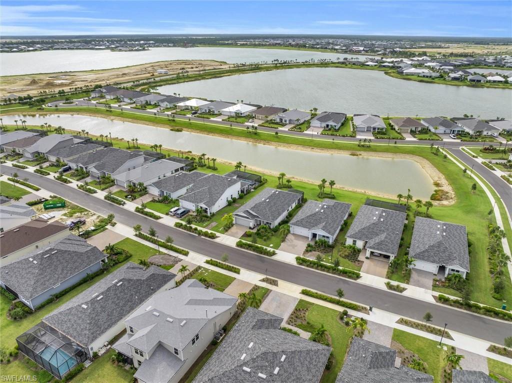 42322 Edgewater Drive Babcock Ranch, FL 33982 - Photo 30 of 40 aerial view of a city with an ocean