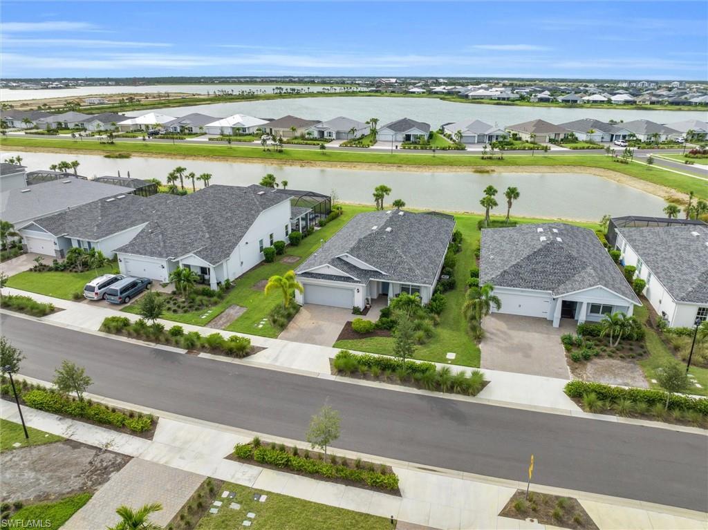 42322 Edgewater Drive Babcock Ranch, FL 33982 - Photo 34 of 40 an aerial view of a house with a lake view