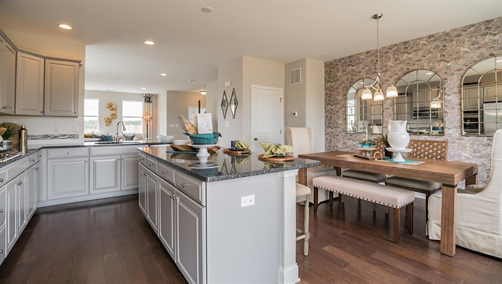 1705 Hights Farm Road South Raleigh, NC 27603 - Photo 15 of 25 a kitchen with a sink stove and cabinets