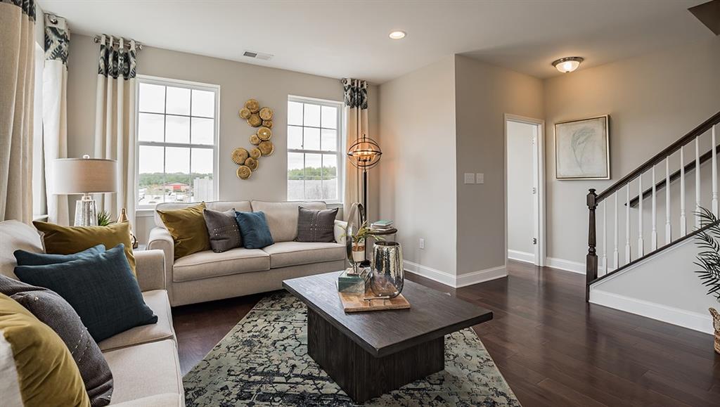 1705 Hights Farm Road South Raleigh, NC 27603 - Photo 19 of 25 a living room with furniture and a window