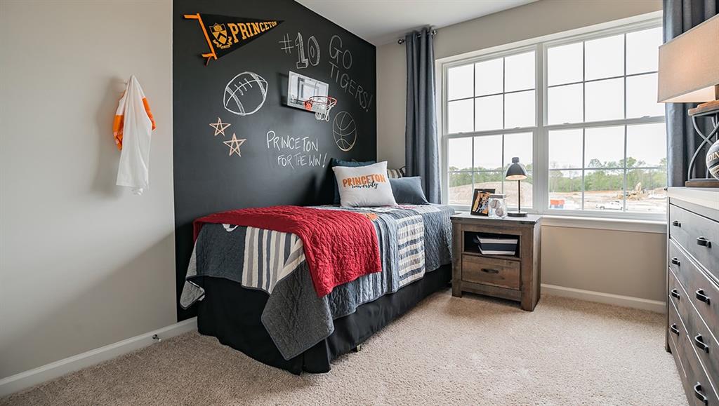 1705 Hights Farm Road South Raleigh, NC 27603 - Photo 10 of 25 a bedroom with a bed and a window