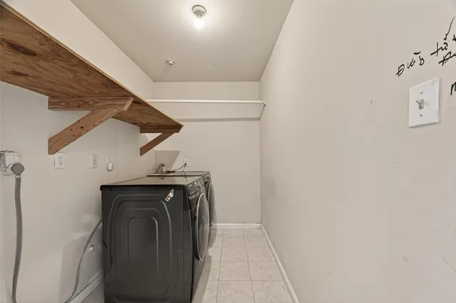 a view of a hallway with washer and dryer
